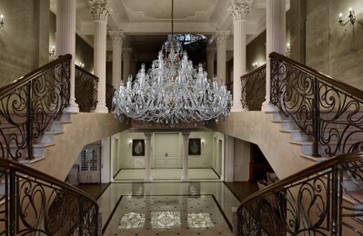 Crystal chandelier above the staircase in chateau style EL1073501